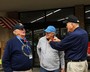 Post 370 Legionnaire Bill Edwards pins on a poppy as Post 370 Legionnaire Dr. Carter Davis looks on.